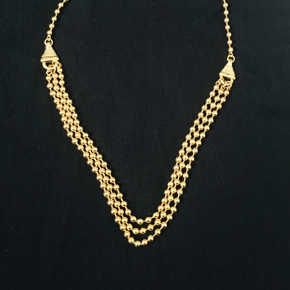 Gold plated three strand beaded necklace.